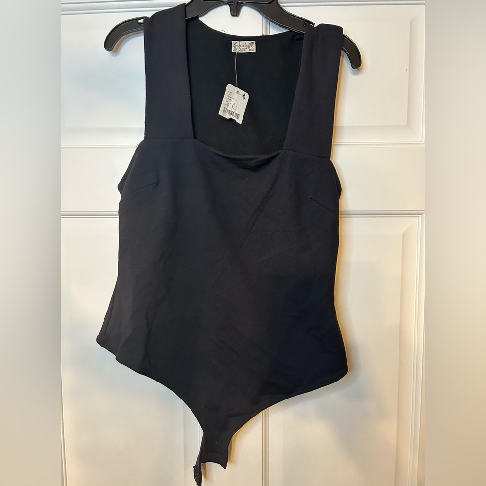 Women’s Free People bodysuit.  NWT size medium.